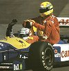 Nigel Mansell gives Ayrton Senna a lift. Image by Eileen Buckley.