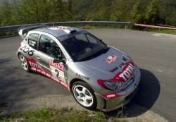 Auriol managed third, beaten only by his team mate Panizzi and Loeb in the Citroen Xsara. Picture by Peugeot.