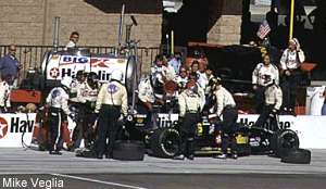 Michael Andretti's ill fated green flag pitstop...note the bucket of water being poured on burning left rear brake.