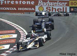 leaders coming through the corkscrew under caution awaiting restart