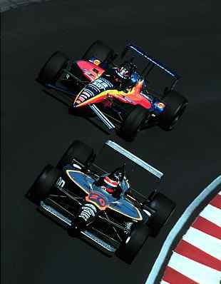 Nazareth CART GP: 2-5-99, Nazareth Pennsylvania, USA. PJ Jones passes Robby Gordon in turn 3 -1999, Michael L. Levitt, USA. LAT Photographic