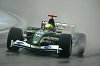 Mark Webber puts the Jaguar on provisional pole in rain-soaked conditions at the Brazilian GP. Photograph by Jaguar. Click here for a larger image.