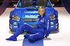 New Subaru Impreza WRC car for 2003 (erm, behind the lovely lady... Photograph by Mark Sims. Click here for a larger image.