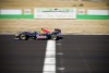 Tom Cruise drives a Red Bull F1 car. Image by Garth Milan.