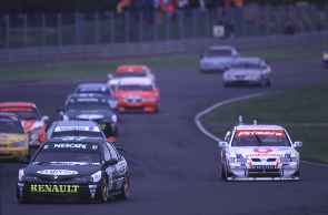Jason Plato takes the lead on the opening lap of the feature race.