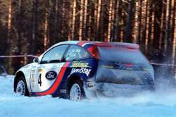 Colin McRae in the Ford Focus. Photograph by Robert Chambers.