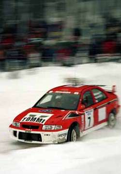 Tommi Makinen in the Mitsubishi Lancer. Photograph by Robert Chambers.
