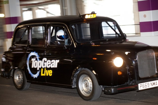 The Stig takes Chris Evans for a ride. Image by Top Gear Live.
