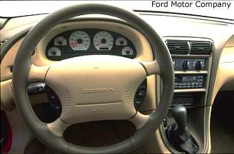 The interior cocoons the driver in leather